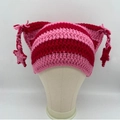 Pink and red striped knit cat ear hat with handmade star charms on hanging braided ropes - Red Pink Stripes