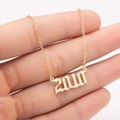 Golden stainless steel necklace featuring a gothic 2010 year pendant held by hand - 2010 / Gold