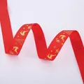 Close-up of red grosgrain ribbon with gold reindeer and snowflake patterns for gifts - Gold Stamping Red Deer (2.5cm Width 5m Length)