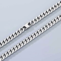 Macro shot of silver Cuban link chain featuring a lobster clasp and polished finish - 8mm Width-Toggle Clasp-45cm Length