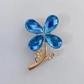 Sky blue crystal flower brooch pin with golden alloy stem and shimmering rhinestones - Sky Blue Teardrop Flower