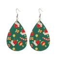Close-up of green teardrop leather earrings with festive Christmas tree patterns - Green Base Christmas Elements Print