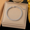Elegant silver wheat chain bracelet in titanium steel with lobster clasp and extension - Wrapped Wheat Chain Silver