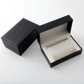 Detail view of black faux leather watch box with white soft cushion for single watch storage - Black Leather Texture Single Watch Box