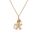 Collana omino di pan di zenzero con cappello di Natale rosso e pavé di zirconi - Omino di pan di zenzero dorato
