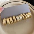 Detail of assorted gold and silver hoop earrings with hammered and braided textures - Silver Pin-Gold (10-Piece Set)