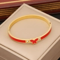 Gold stainless steel butterfly bangle with red enamel inlay and zircon accents - Red