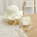 Detailed view of cream straw hat and bag set with organza bows and pearl accents - Cream White Hat + Bag Set