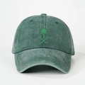 Detail of the palm tree and crossed swords emblem on the washed green baseball cap - Dark Green