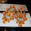 Macro detail of luxury teardrop earrings with orange gemstones and sparkling crystals - S925 Silver Needle Style / Champagne