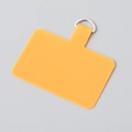 Macro view of orange TPU phone lanyard patch with durable silver metal D-ring attachment - Silver Clasp / Orange