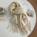 Minimalist beige cashmere-feel winter scarf with long fringe and branded tag in cream - 200cm / Cream