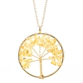 Macro detail of handmade life tree pendant with gold wire and yellow crystal stones - Gold + Citrine