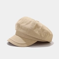 Macro detail of the beige corduroy fabric texture on a vintage newsboy octagonal hat - Khaki