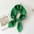 Green silk square scarf with black geometric lines tied in a stylish knot - Dark Green Striped Weave