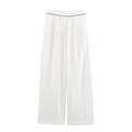 Detail of high-waisted white wide-leg trousers with elegant black piped trim at the waist - XS / Bottoms