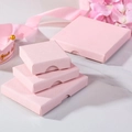 Pink cross-textured jewelry gift boxes in four sizes on a white marble background - Light Pink