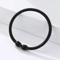 Detail of black twisted cable magnetic therapy bracelet with polished bead end caps - Black