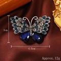 Spilla farfalla retrò con strass blu e lega d'argento su sfondo di seta marrone - Blu navy