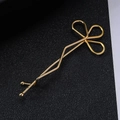 Golden wavy hair clip featuring a minimalist hollow floral design for women - Flower Style