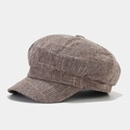 Detailed side view showing brown plaid texture on a vintage British style octagonal cap - Khaki