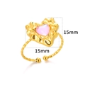 Detail of 18K gold heart ring with pink stone inlay and twisted rope band texture - Gold Pink Heart