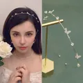 Cerchietto con farfalla dorata con strass scintillanti e accenti in zirconia cubica - Farfalla Dorata Strass Distanziati
