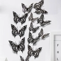 Macro shot of 3D black hollow butterfly wall stickers arranged on a white wall decor - Black