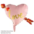 Pink heart-shaped foil balloon with gold 'love' text for Valentine's Day decor - Arrow through Heart