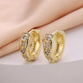 Macro detail of 18K gold hoop earrings featuring round and square cubic zirconia stones - Geometric Round Square Alternate