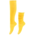 Detail of yellow knit slouch socks featuring ribbed texture and thick cable knit patterns - Yellow