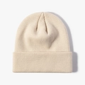 Beige ribbed knit beanie hat with rolled cuff for winter warmth and outdoor wear - Beige