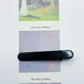 Minimalist glossy black 6cm duckbill hair clip on artistic bookmark background - Black