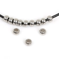 Polished silver stainless steel flat spacer beads on a black cord for DIY jewelry making - 5x3mm Spacer Bead (2.5mm Hole) (20 Pieces/Pack)