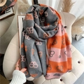 Detailed shot of reversible thick butterfly scarf in gray and pink with fringe - Gray