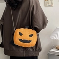 Sparkly orange pumpkin crossbody bag with black bat wings and metal chain strap - Sequin Brown