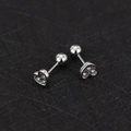 Detailed macro view of heart-shaped zircon ear studs with secure screw ball back closure - Heart - Steel