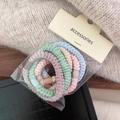 Close-up of 5-piece colorful plush elastic hair bands set in transparent packaging - Ruched Ruched Style