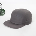 Detail showing high-quality cotton fabric and breathable metal eyelets on the charcoal five-panel hat - Dark Gray
