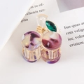 Elegant purple marble acetate hair claw with green rhinestone on a book background - Purple Marble Cherry