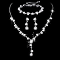 Macro shot of silver sunflower necklace set with sparkling rhinestones and white pearls - 483 Artificial Pearl 3-Piece Collection