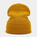 Detailed view of ginger yellow knitted beanie showing fine ribbed texture and wide cuff - Ginger Yellow