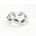 Polished silver leaf pattern open ring detail view on clean white background - Oval Leaf Linked Design (R6057)