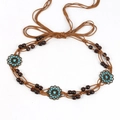 Detail of bohemian brown woven waist chain with bronze flower charms and blue rhinestones - Sunflower