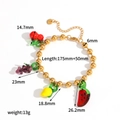Bracciale di frutta fatto a mano con ciondoli ciliegia uva e limone su sfondo bianco - Bracciale (TB5125)
