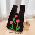 Cute black knit tote bag featuring pink flower embroidery and minimalist style - Black Background Rose Flowers