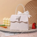 Elegant white handbag-shaped gift box with pearl handle and silk ribbon bow detail - White
