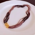 Multi-strand pearl necklace in burgundy and purple gradient with gold butterfly hardware - Dark Purple Double G Buckle Beaded Necklace