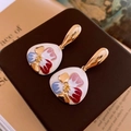Macro shot of French style floral earrings with colorful enamel glaze on a vintage book - No.33 925 Silver Needle Gold White