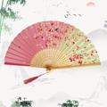 Chinese bamboo folding fan with pink cherry blossoms, gradient design, and red tassel - Red Tassel First Sight - Pink